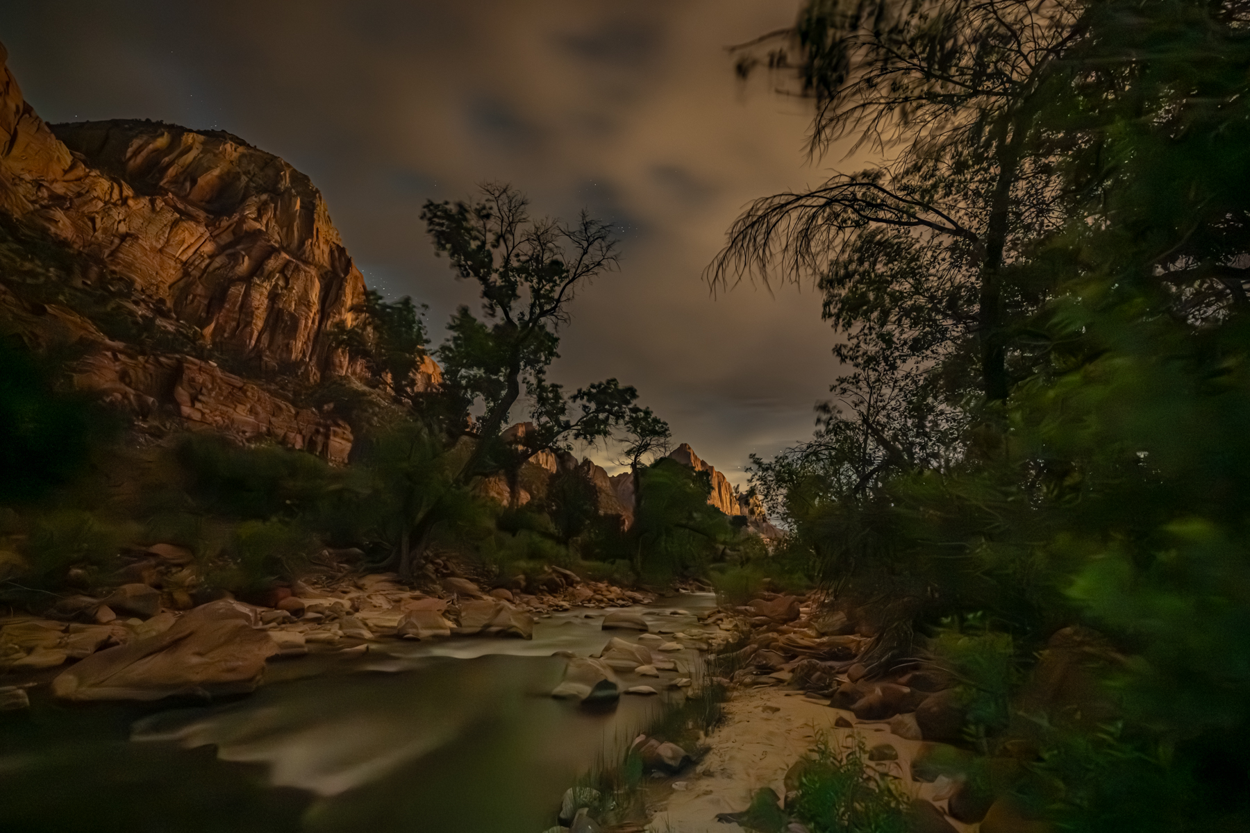 Clouds and canyon landscape at night in Zion
